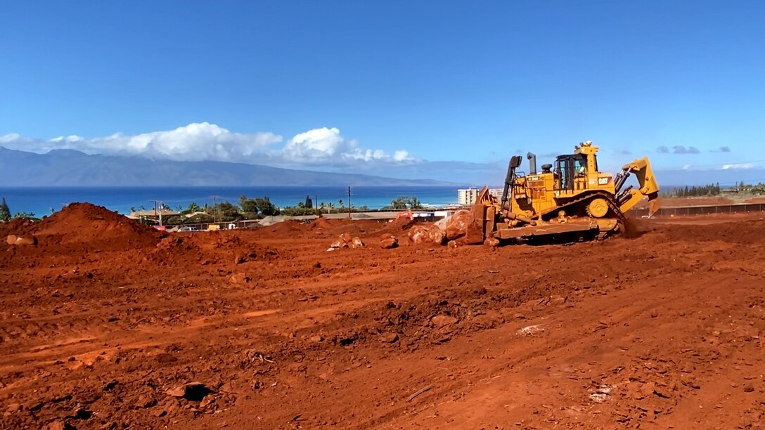 U.S. Army Corps of Engineers contractors prepare a site for construction of a new temporary elementary school campus for the Lahaina, Hawai'i, community, Nov. 25, 2023, after receiving the Notice to Proceed Nov. 20. The base contract for $53.7 million was awarded to Pono Aina Management, LLC, of Waianae, Hawai‘i, Nov. 4. It is anticipated that the temporary school will be handed over to the Department of Education for furnishing and installation of telecommunication equipment by the end of February 2024. (U.S. Army Corps of Engineers photo by Sara Goodeyon)