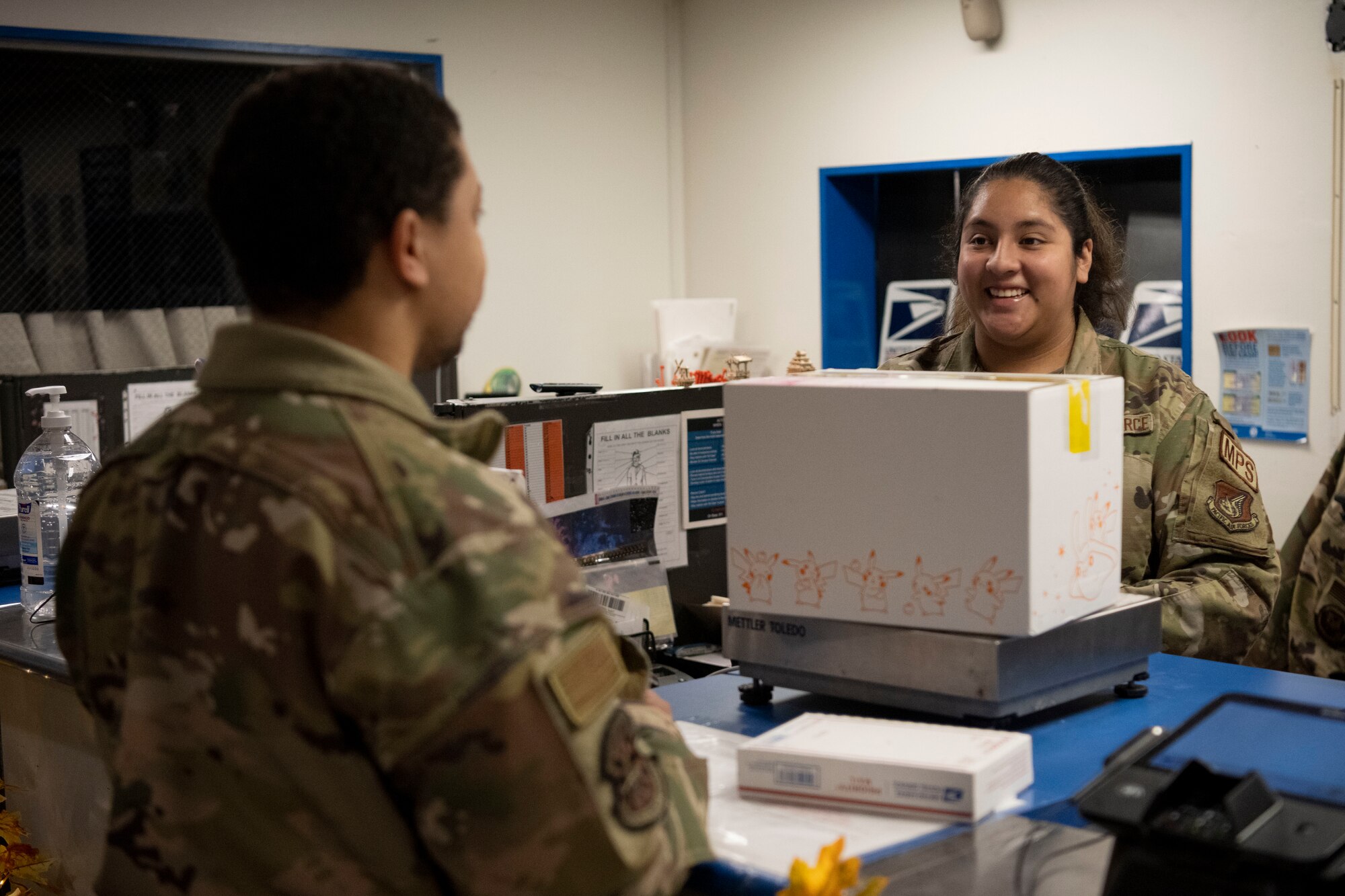 A military member has a package registered at a post office.