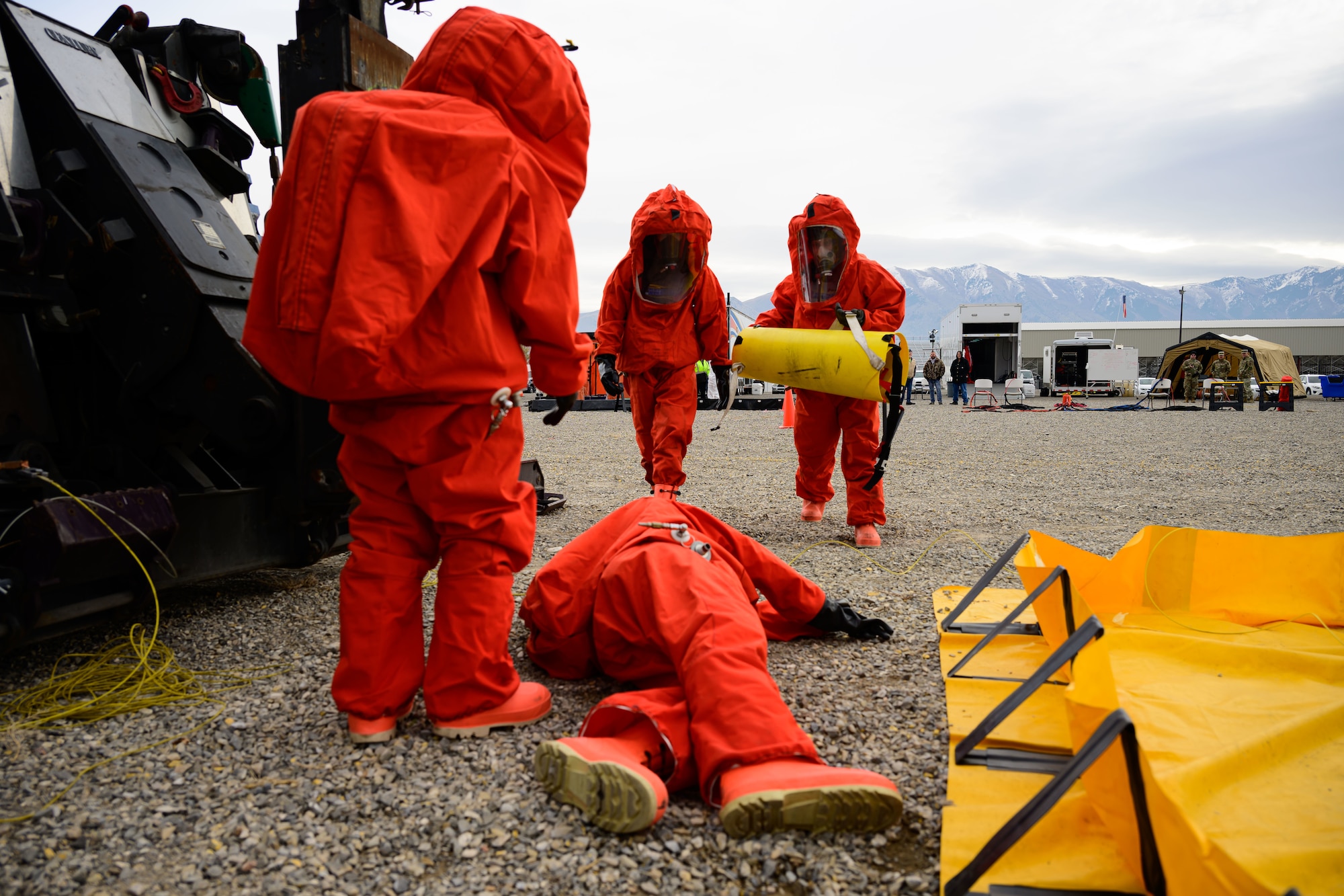 Members of the Missile Mishap Recovery Team respond to a simulated casualty during an exercise simulating a transportation accident involving a missile component containing hazardous material at the Box Elder County Fairgrounds, Tremonton, Utah, Nov. 2, 2023. The MMRT is on call 24/7, 365 days a year to respond to any number of situations involving an intercontinental ballistic missile where technical procedures do not exist to address the mishap or the loss of life is possible. (U.S. Air Force photo by R. Nial Bradshaw)