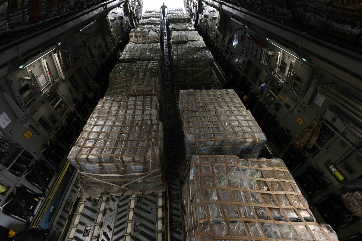 Cargo is loaded in an aircraft.