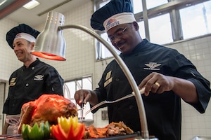 Leaders provide turkey to service members and their families.