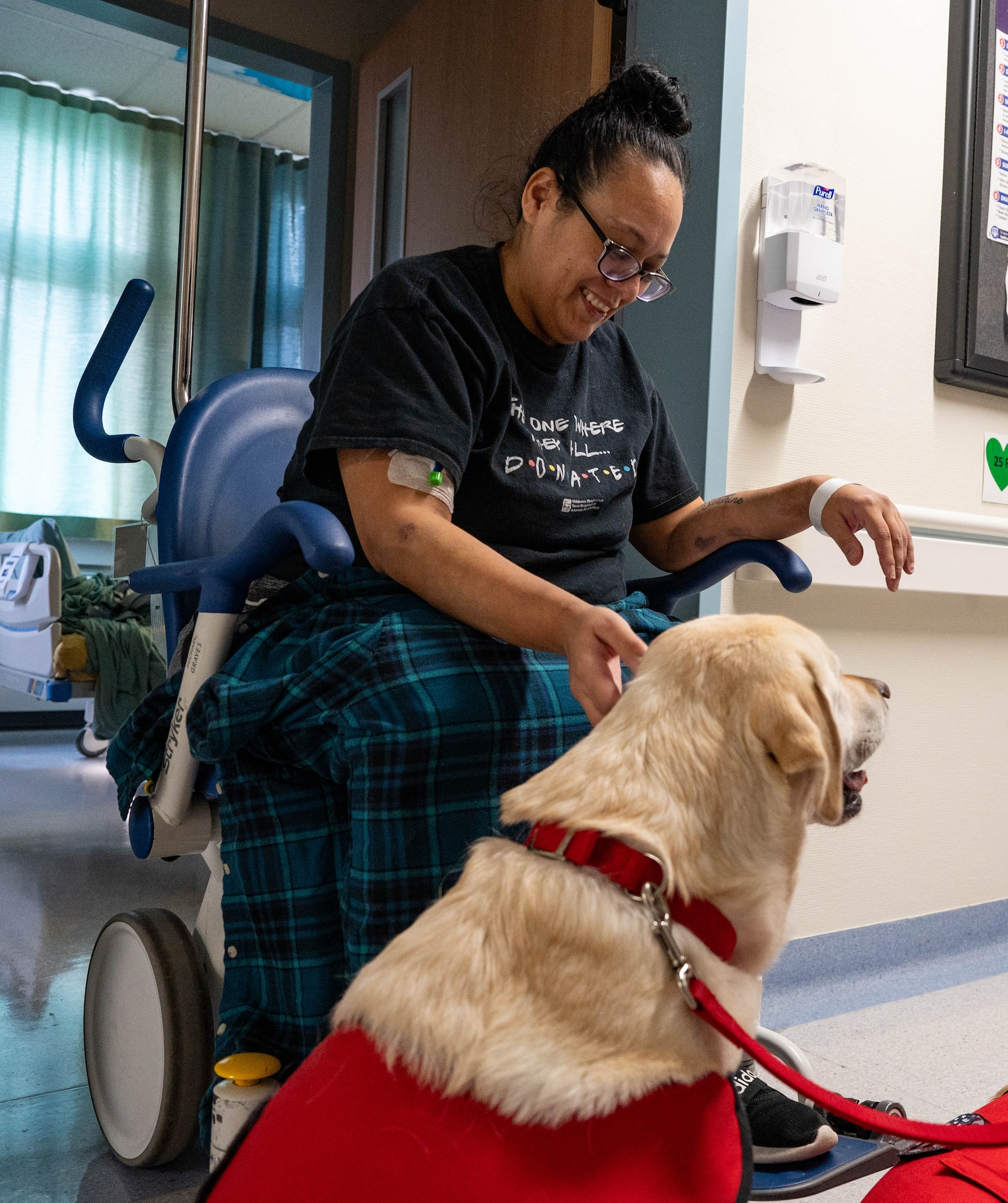 Service dog visits patient.