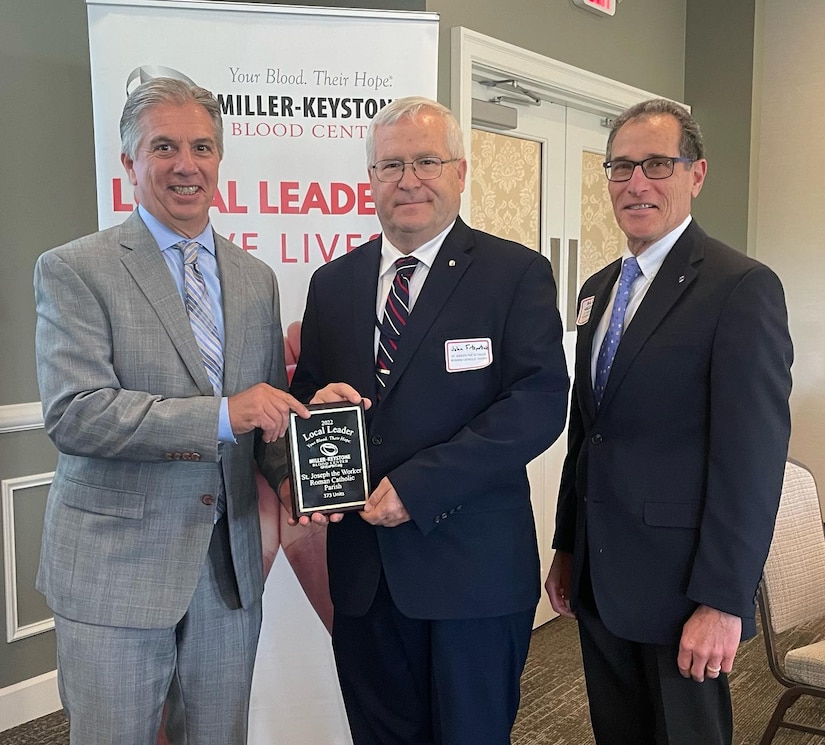 Photo of John Fitzpatrick accepting an award