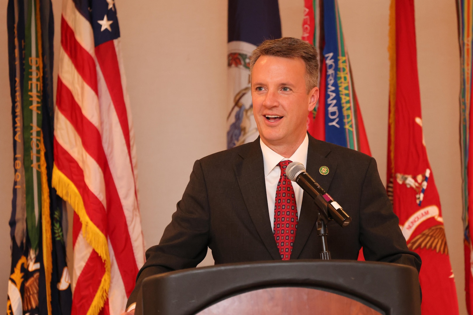 Man at podium speaking