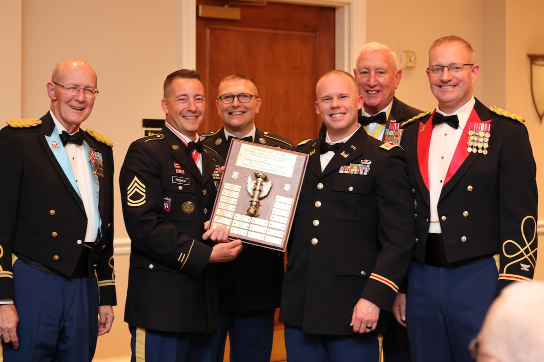 Soldiers holding awards