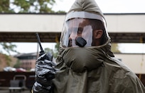 Joint Base Charleston Airmen participate in a medical exercise where they act as patients with simulated wounds. Medical Group staff wear protective hear as they treat the simulated patients.