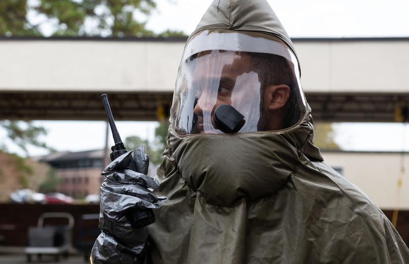 Joint Base Charleston Airmen participate in a medical exercise where they act as patients with simulated wounds. Medical Group staff wear protective hear as they treat the simulated patients.