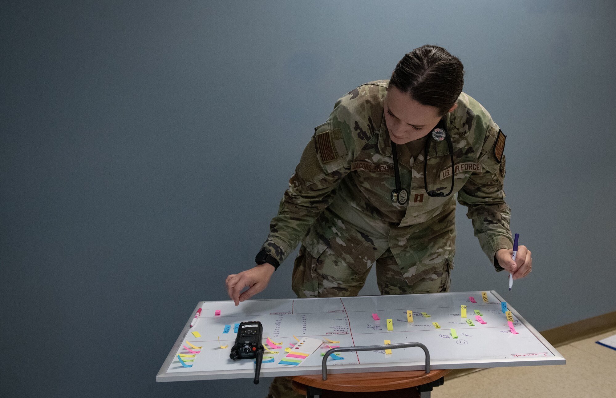 Joint Base Charleston Airmen participate in a medical exercise where they act as patients with simulated wounds. Medical Group staff wear protective hear as they treat the simulated patients.