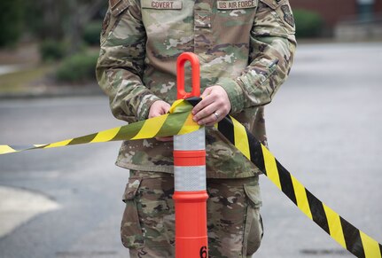 Joint Base Charleston Airmen participate in a medical exercise where they act as patients with simulated wounds. Medical Group staff wear protective hear as they treat the simulated patients.