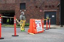Joint Base Charleston Airmen participate in a medical exercise where they act as patients with simulated wounds. Medical Group staff wear protective hear as they treat the simulated patients.