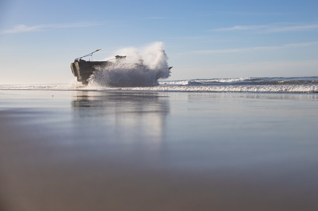 U.S. Marines assigned to the 3rd Assault Amphibian Battalion, 1st Marine Division, conduct waterborne training with an Amphibious Combat Vehicle from shore to loading amphibious transport dock ship USS Anchorage at Marine Corps Base Camp Pendleton, California, Feb. 12, 2022. The two-day waterborne training evolution focused on safety and transport capabilities for both the Marine Corps and Navy and is part of a larger training plan to refine tactics and doctrine for amphibious operations.
