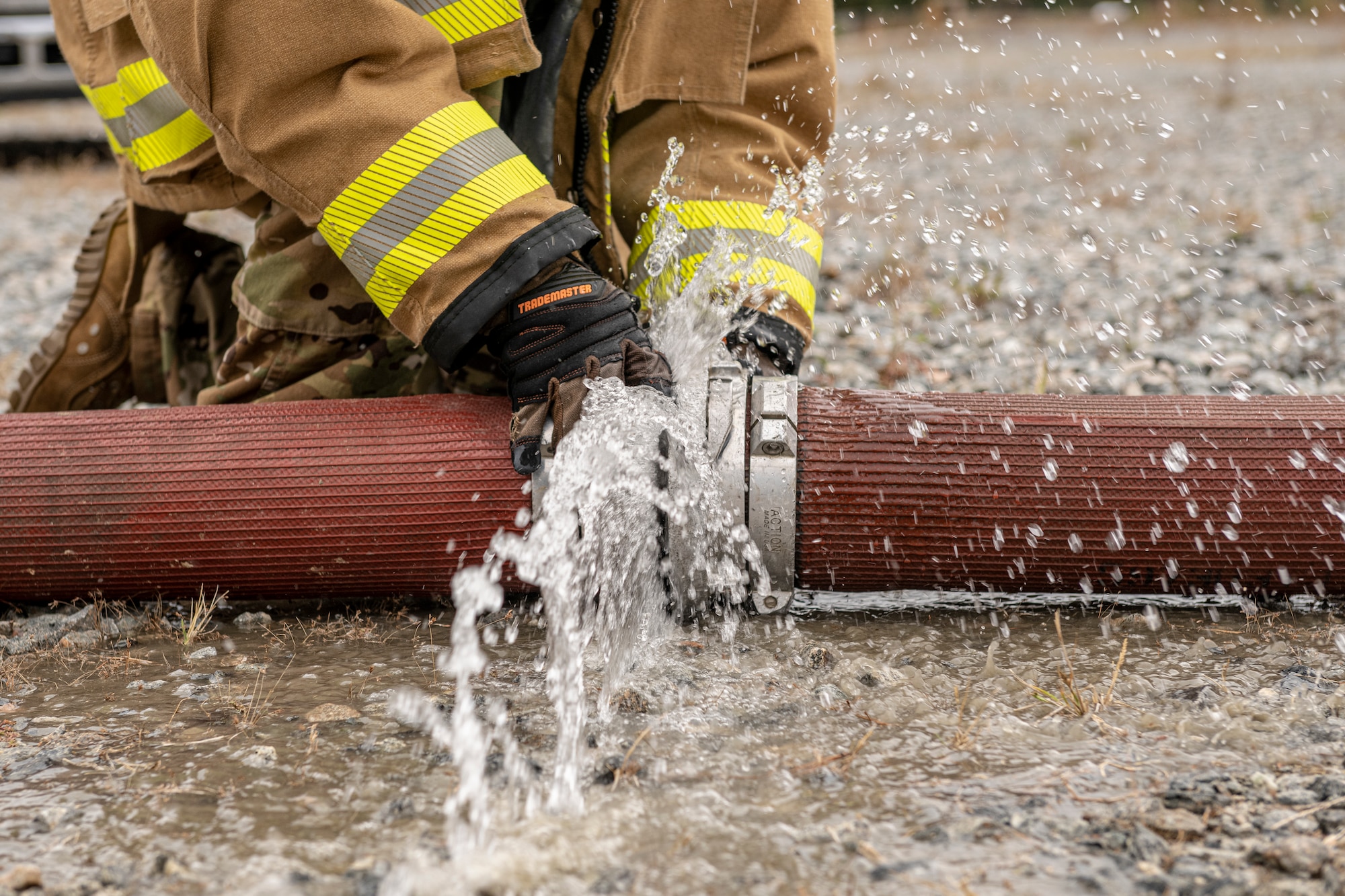 An Airman assigned to the 23rd Civil Engineer Squadron Fire Department disconnects hoses
