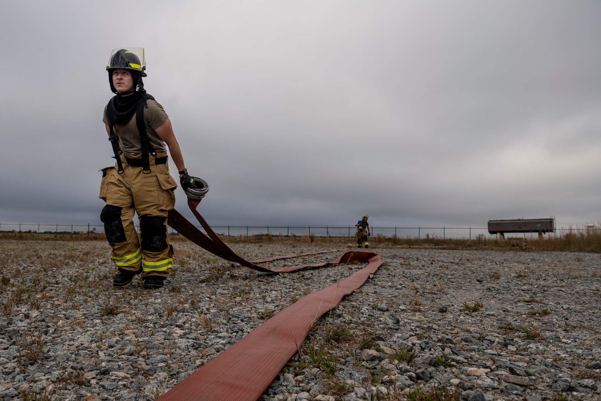 Airmen assigned to the 23rd Civil Engineer Squadron Fire Department clean up after live-fire training