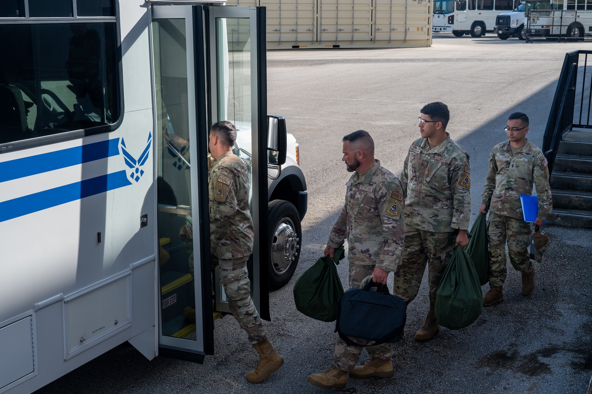 Members of Space Launch Delta 45 board a bus during a personnel deployment function line at Patrick Space Force Base, Florida, Oct. 5 2023. The 45th Logistics Readiness Squadron hosted its first PDF line, used to help streamline the pre-deployment process for service members, in more than 13 years. (U.S. Space Force photo by Airman 1st Class Spencer Contreras)