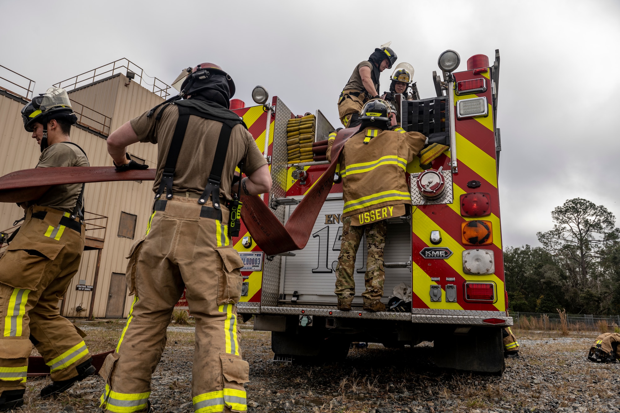 Airmen assigned to the 23rd Civil Engineer Squadron Fire Department clean up after live-fire training