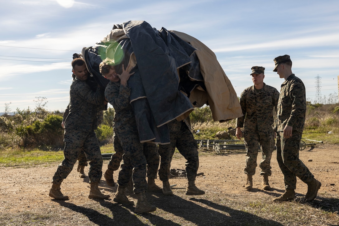 U.S. Marines with Marine Air Support Squadron 3, Marine Air Control Group 38, 3rd Marine Aircraft Wing, set up the Multifunction Air Operations Center in support of exercise Steel Knight 23.2 at Marine Corps Base Camp Pendleton, California, Nov. 27, 2023. The MAOC provides operational command as well as air surveillance that demonstrates 3rd MAW’s readiness and flexibility to conduct missions. Steel Knight 23.2 is a three-phase exercise designed to train I Marine Expeditionary Force in the planning, deployment and command and control of a joint force against a peer or near-peer adversary combat force and enhance existing live-fire and maneuver capabilities of the MAGTF. (U.S. Marine Corps photo by Sgt. Sean Potter)