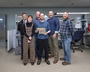 Project team members (from left) include: Gerald Centeno, electronics engineer, Code 290, Combat Systems Engineering & Planning; Emily Saito, electronics engineer, NUWC Division, Keyport; Nick Jones, cell manager, Code 1010, Reactor Systems; Tommy Kidwell, electrical inspector, Code 720, Lifting and Handling Quality Assurance, Testing and Training; Adam Hocutt, technical project manager, NUWC Division, Keyport; and Jason Brandt, electronics engineer, NUWC Division, Keyport. (U.S Navy photo)