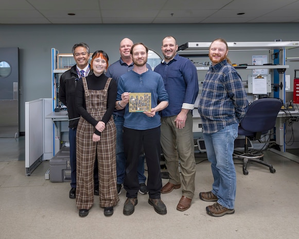 Project team members (from left) include: Gerald Centeno, electronics engineer, Code 290, Combat Systems Engineering & Planning; Emily Saito, electronics engineer, NUWC Division, Keyport; Nick Jones, cell manager, Code 1010, Reactor Systems; Tommy Kidwell, electrical inspector, Code 720, Lifting and Handling Quality Assurance, Testing and Training; Adam Hocutt, technical project manager, NUWC Division, Keyport; and Jason Brandt, electronics engineer, NUWC Division, Keyport. (U.S Navy photo)