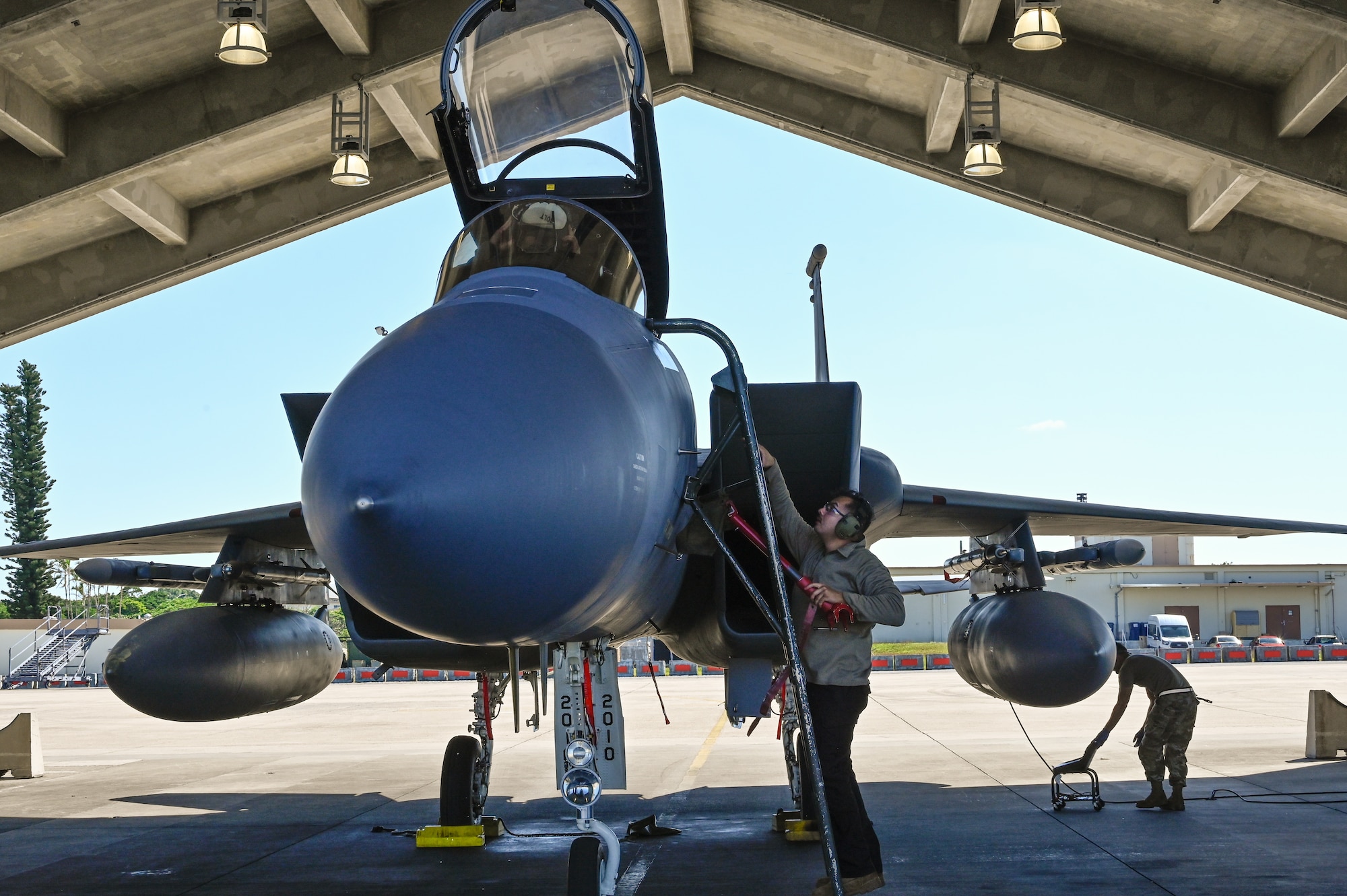 Airmen prepare an F-15C fighter jet for take off
