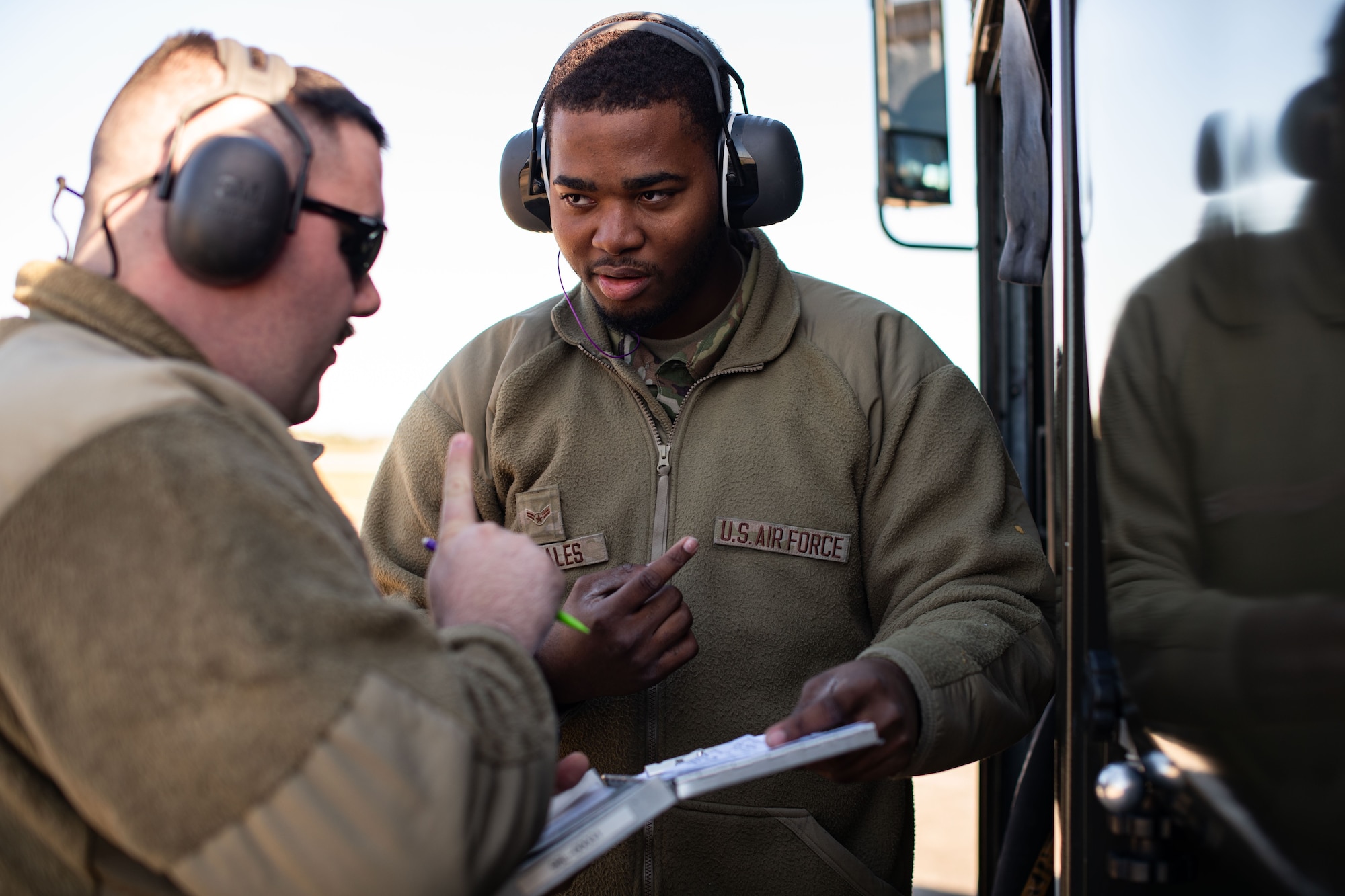 Airmen check documents.