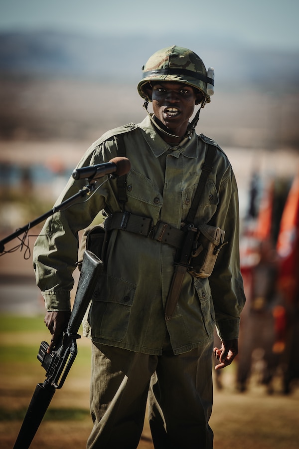 U.S. Marine Corps Lance Cpl. Azaar Elliot, a Portsmouth, Virginia native, administrative specialist with Headquarters Battalion, Marine Corps Air-Ground Combat Center, showcases a historical Marine Corps Vietnam War uniform during the 248th Marine Corps’ Birthday Pageant at MCAGCC, Twentynine Palms, California, Nov. 9, 2023. The birthday pageant is an annual tradition that includes the uniform pageant, as well as the traditional cake cutting ceremony in honor of the Marine Corps’ birthday. (U.S. Marine Corps photo by Lance Cpl. Richard PerezGarcia)