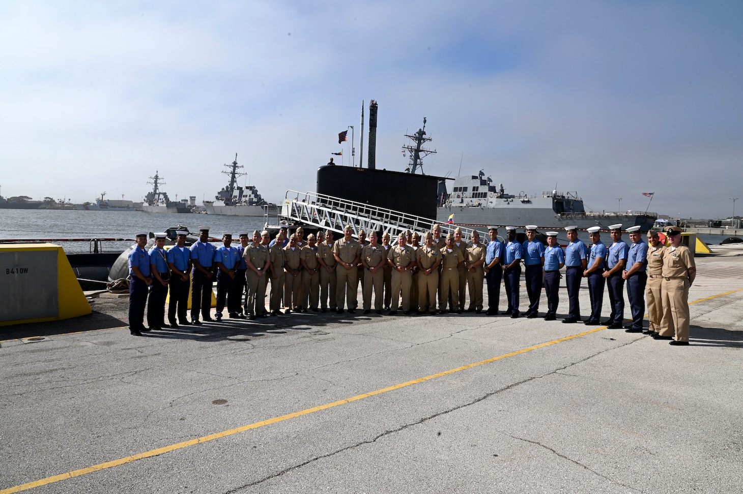 Colombian Navy Submarine ARC Pijao Sailors join Vice Adm. Orlando Grisales, Colombian Navy Chief of Staff for Naval Operations, in a group photo following an award ceremony at Naval Station Mayport, Florida.