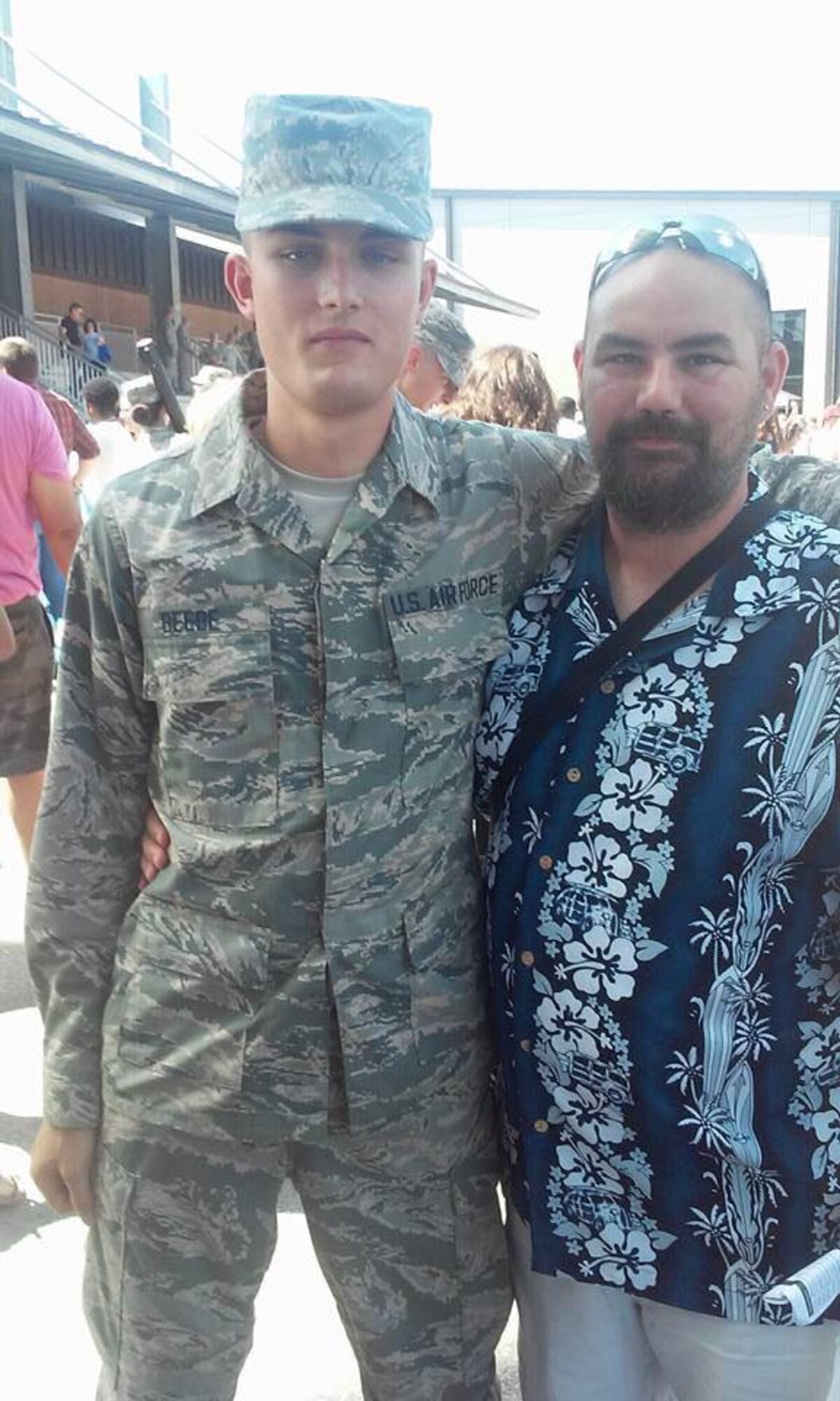 From left, then U.S. Airman Basic Jacob Beebe and his father, Orin Pickering, pose for a photo after Beebe’s basic military training graduation at Joint Base San Antonio-Lackland, Texas, in July 2015