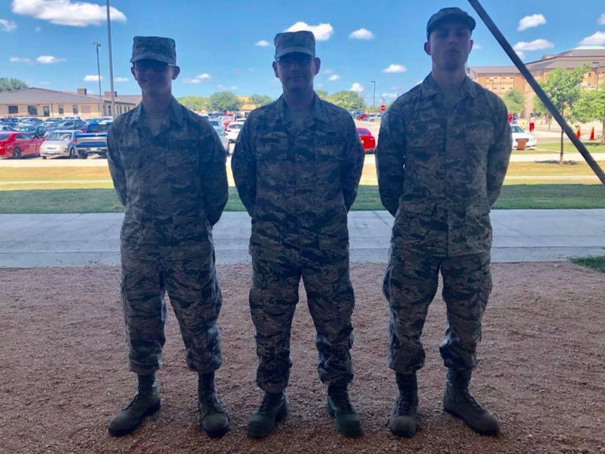 From left, then U.S. Airman Basic Dylan Pickering, along with his father, then Airman 1st Class Orin Pickering and his brother then Senior Airman Jacob Beebe, pose for a photo at Joint Base San Antonio-Lackland, Texas, in June 2018.