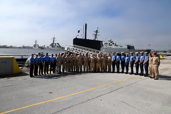Colombian Navy Submarine ARC Pijao Sailors join Vice Adm. Orlando Grisales, Colombian Navy Chief of Staff for Naval Operations, in a group photo following an award ceremony at Naval Station Mayport, Florida.