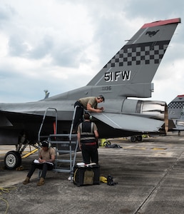 U.S. Air Force maintainers with the 36th Fighter Generation Squadron, Osan Air Base, Republic of Korea, perform a pre-flight maintenance inspection on a U.S. Air Force F-16 Fighting Falcon assigned to 36th Fighter Squadron, during Commando Sling 23 at Lebar Air Base, Republic of Singapore, Nov. 15, 2023.