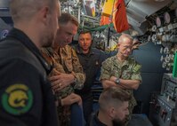 NAPLES, Italy. -  Rear Adm. Stephen Mack, commander, Submarine Group 8, receives a brief from engineers assigned to the Italian Todaro-class submarine, Scirè (S 527), during U.S. and Italian Navy undersea warfare staff talks, in Naples Italy, Nov. 20, 2023. While in Naples, the Scirè hosted Italian Navy Rear Adm. Vito Lacerenza, Commander of the Submarines, and Rear Adm. Mack, further strengthening the U.S. and Italian partnership. (U.S. Navy photo by Mass Communication Specialist 1st Class Ryan Seelbach)