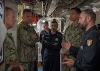 NAPLES, Italy. -  Rear Adm. Stephen Mack, commander, Submarine Group 8, speaks with Capt. Francesco Barone, right, commanding officer of the Italian Todaro-class submarine, Scirè (S 527), during U.S. and Italian Navy undersea warfare staff talks, in Naples Italy, Nov. 20, 2023. While in Naples, the Scirè hosted Italian Navy Rear Adm. Vito Lacerenza, Commander of the Submarines, and Rear Adm. Mack, further strengthening the U.S. and Italian partnership. (U.S. Navy photo by Mass Communication Specialist 1st Class Ryan Seelbach)