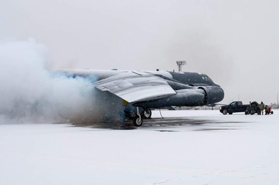 5th Aircraft Maintenance Squadron crew chiefs perform pre-flight procedures on a B-52H Stratofortress at Minot Air Force Base, North Dakota, Nov. 27, 2023. The 5th Bomb Wing Airmen work in all-weather conditions to provide the B-52H global strike capabilities at a moments notice. (U.S. Air Force photo by Airman 1st Class Alexander Nottingham)