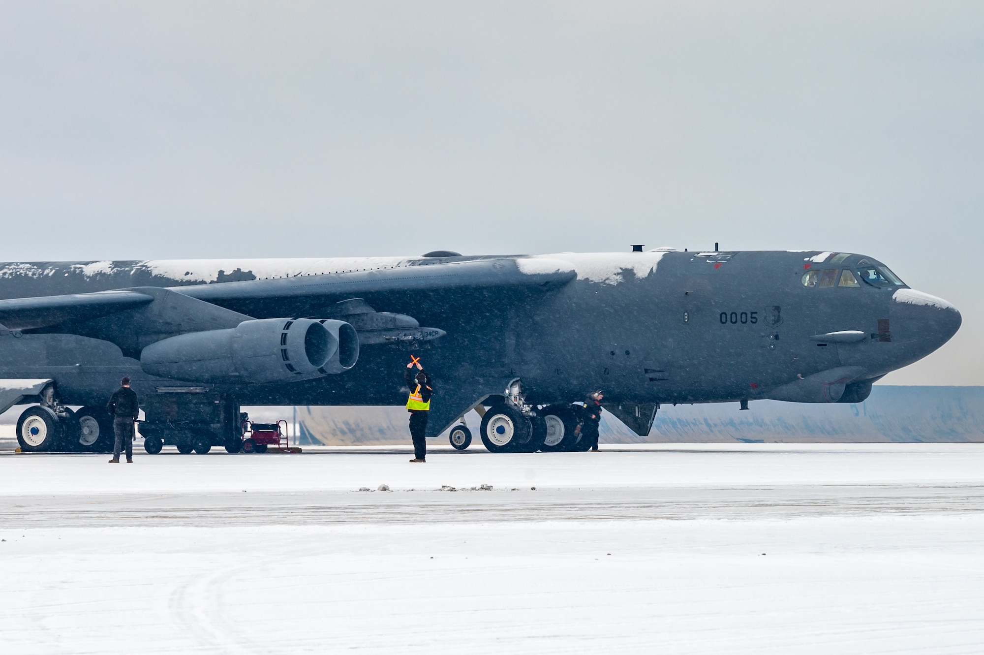 A B-52H Stratofortress taxis on the main parking area at Minot Air Force Base, North Dakota, Nov. 27, 2023. In a conventional conflict, the B-52H can perform strategic attack, close-air support, air interdiction, offensive counter-air and maritime operations. (U.S. Air Force photo by Airman 1st Class Alexander Nottingham)