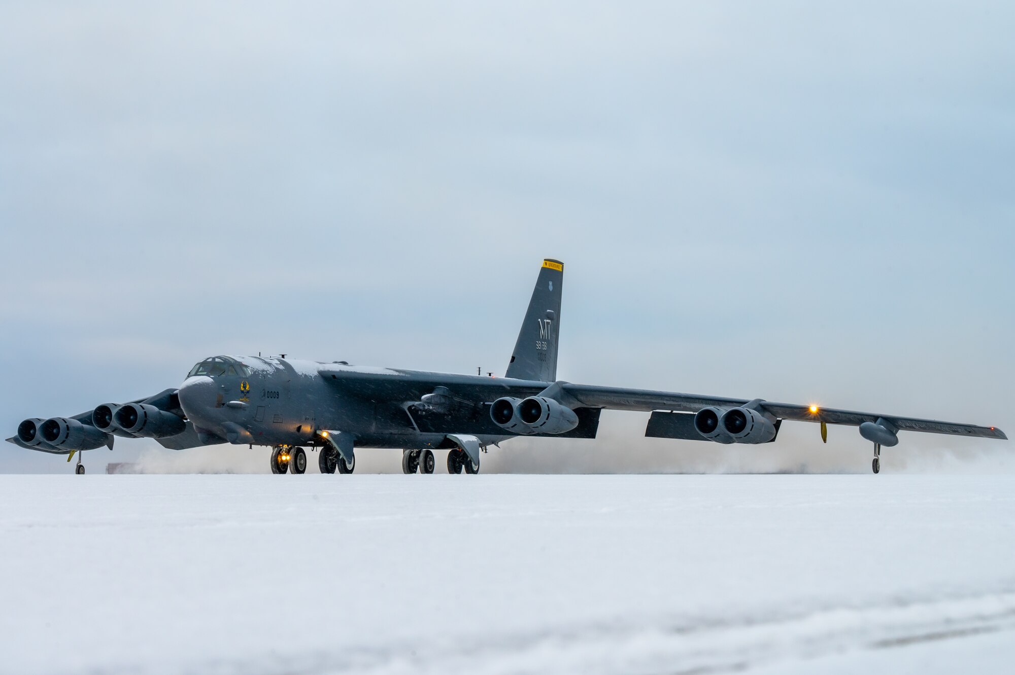 A B-52H Stratofortress  moves toward the taxiway at Minot Air Force Base, North Dakota, Nov. 27, 2023. In a conventional conflict, the B-52 can perform strategic attack, close-air support, air interdiction, offensive counter-air and maritime operations. (U.S. Air Force photo by Airman 1st Class Alexander Nottingham)