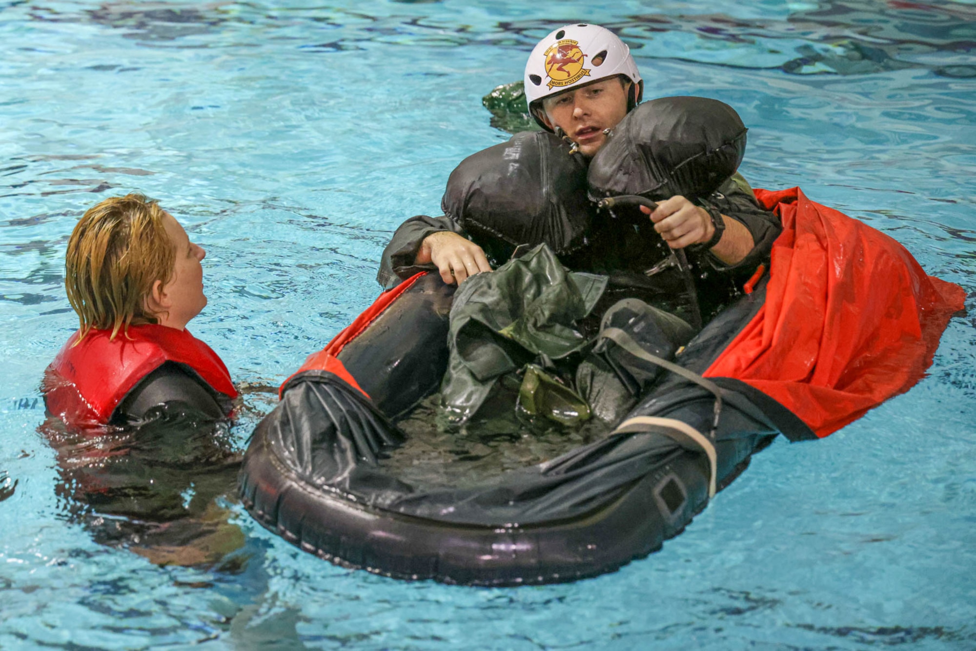 Two airmen in a pool