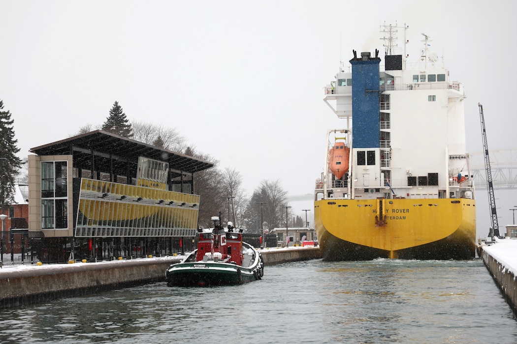 The M/V Happy Rover and tug Wyoming enter the Soo Locks' MacArthur Lock in Sault Ste. Marie, Michigan heading to Lake Superior.