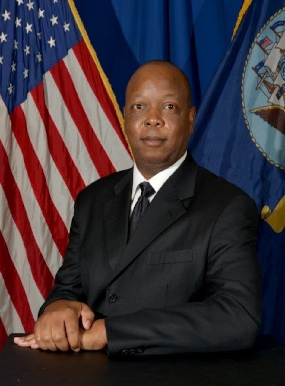 Mr. Barry L. Searles, Director, Naval Computer and Telecommunications Station (NCTS) Singapore