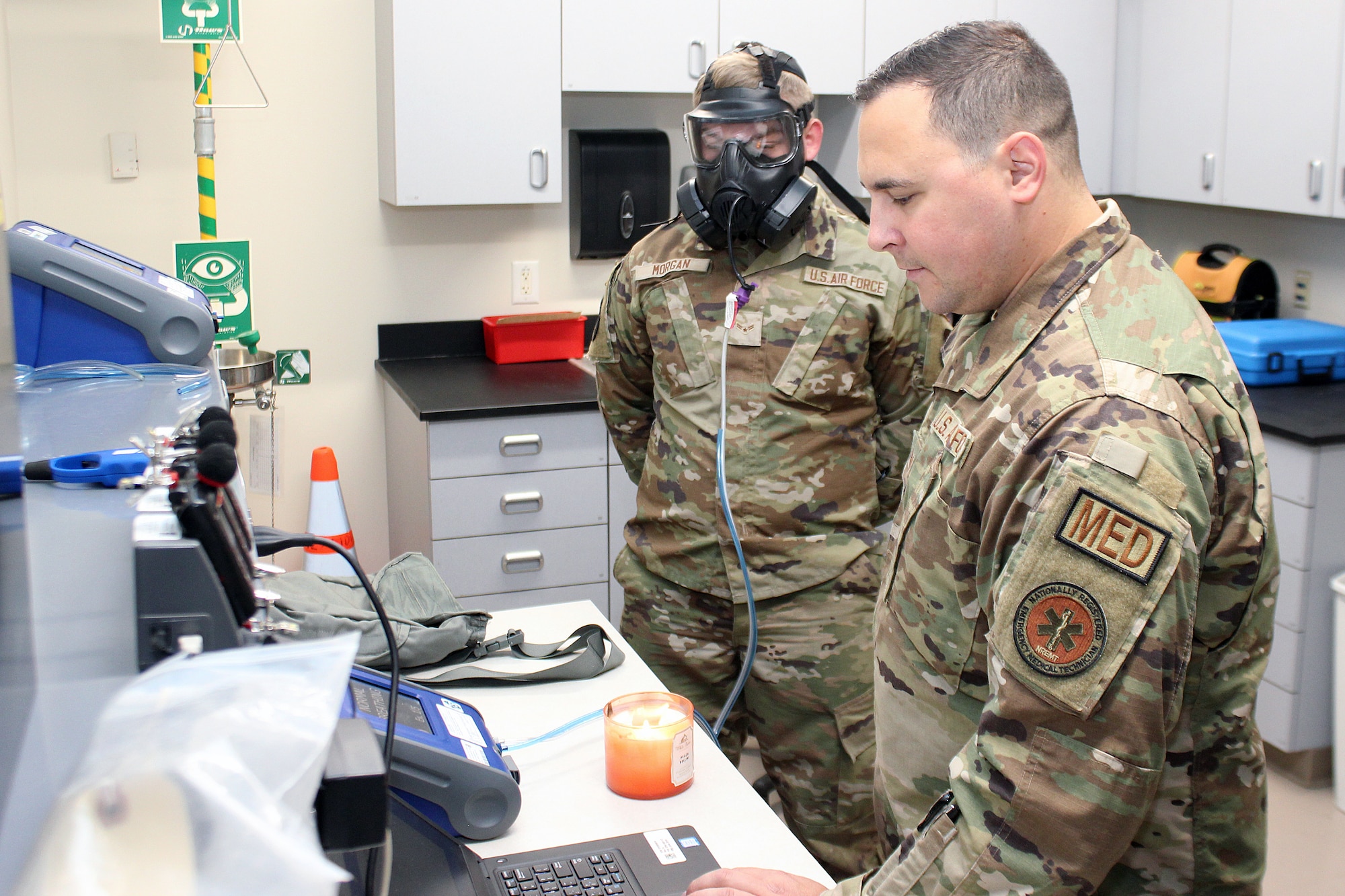 Airman 1st Class Eric Morgan, a power production specialist with the 127th Civil Engineer Squadron, participates in a gas mask fit test being conducted by Staff Sgt. Sean Kozara, a 127th Medical Group medical bioenvironmental technician, at Selfridge Air National Guard Base, Michigan, Oct. 14, 2023.