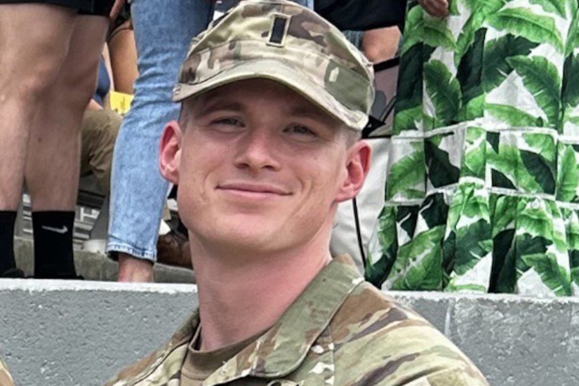 A soldier smiles for a picture.