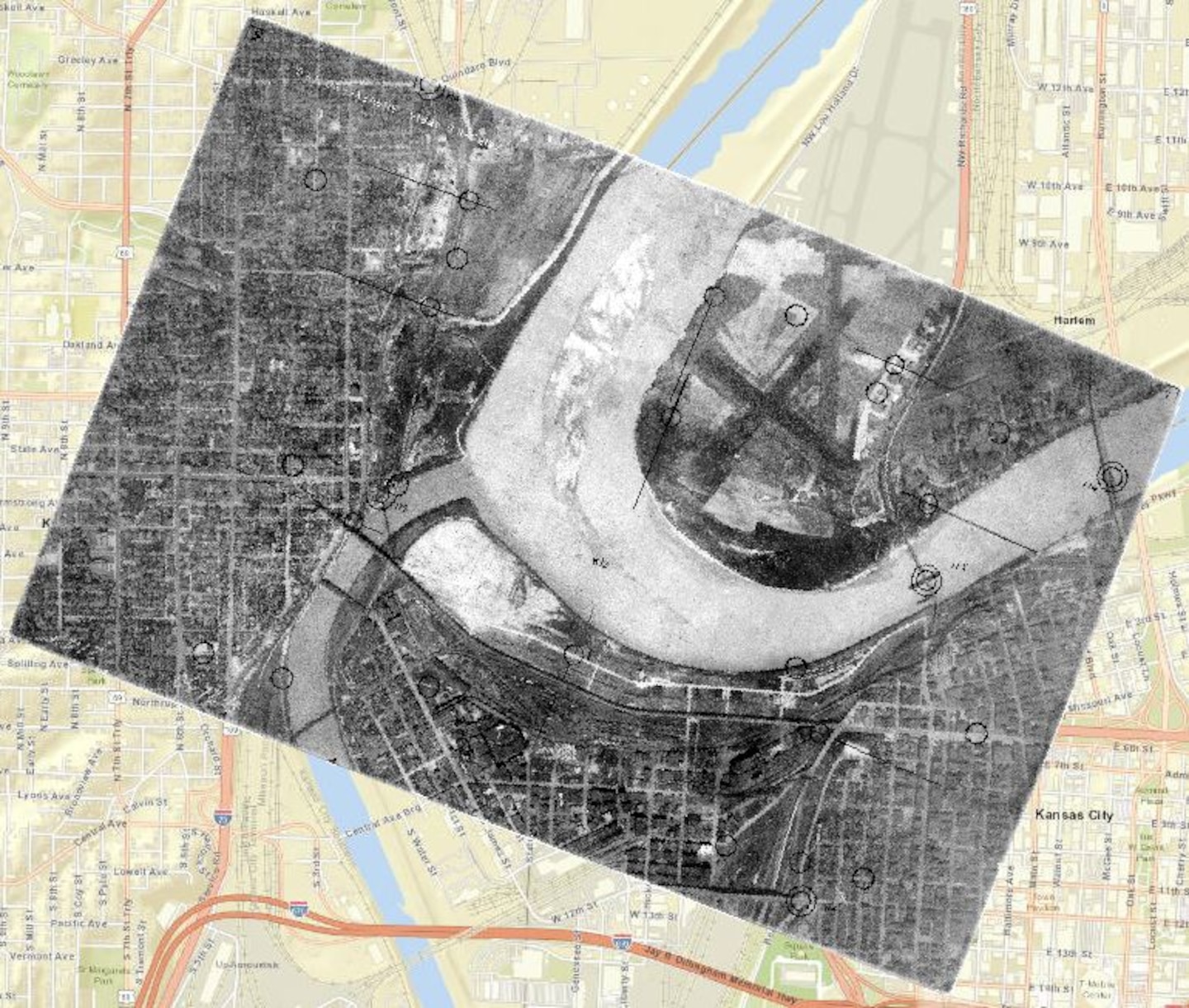 A black and white map sits on top of a beige and yellow map.