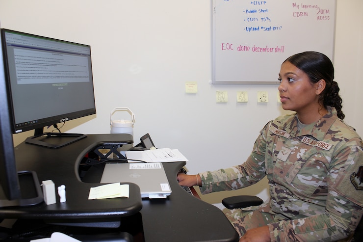 Female Airman working at computer.
