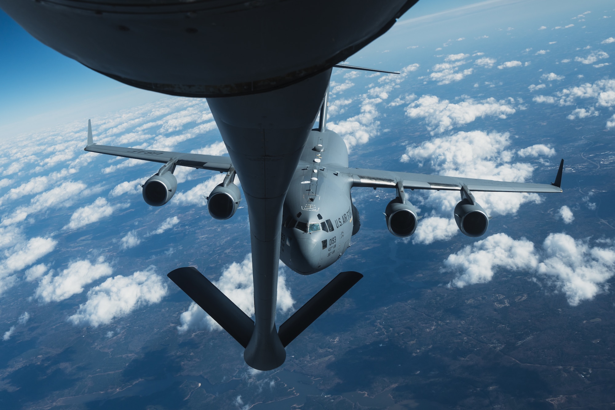 A C-17 Globemaster III assigned to the 15th Airlift Squadron, Joint Base Charleston, South Carolina, approaches a KC-135 Stratotanker assigned to the 63rd Air Refueling Squadron, MacDill Air Force Base, Florida, over the Southeastern United States, Nov. 28, 2023.