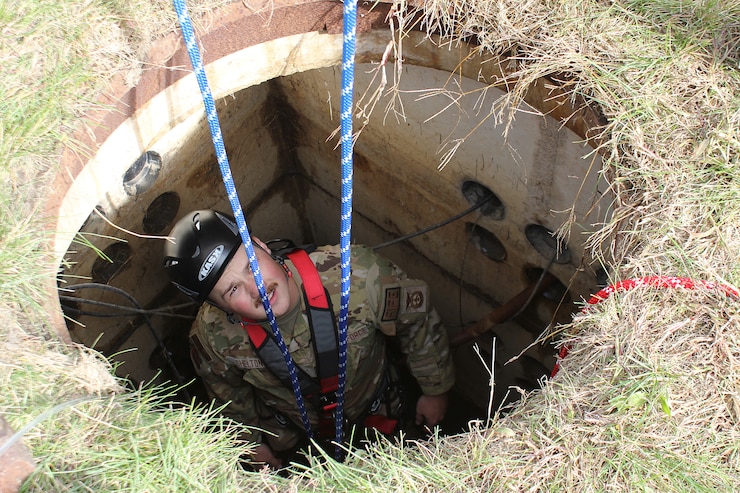 Airman lowered into hole