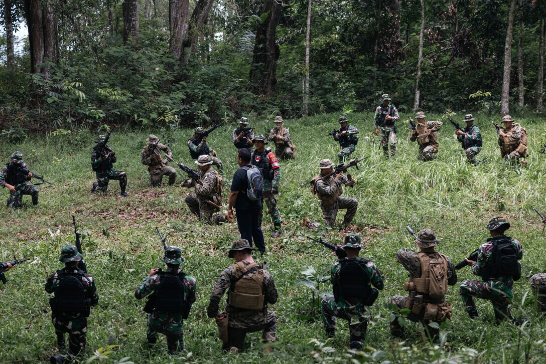 U.S. Marines with 1st Battalion, 7th Marines, attached to Marine Rotational Force-Southeast Asia and Indonesian marines with 4th Marine Infantry Brigade, Pasmar 1, conduct a period of instruction on weapons handling during Keris Marine Exercise 2023 at Piabung Training Area in Sukabumi, West Java, Indonesia, Nov. 27, 2023. Keris MAREX is a bilateral exercise led by the U.S. Marine Corps and the Indonesian Marine Corps, or Korps Marinir, to promote military interoperability and maritime domain awareness capabilities, strengthen relationships, and expand military capabilities among participating forces in the advancement of a Free and Open Indo-Pacific. MRF-SEA is a Marine Corps Forces Pacific operational model that involves exchanges with subject matter experts, promotes security goals with Allies and Partners, and positions I MEF forces west of the International Date Line. (U.S. Marine Corps photo by Sgt. Shaina Jupiter)
