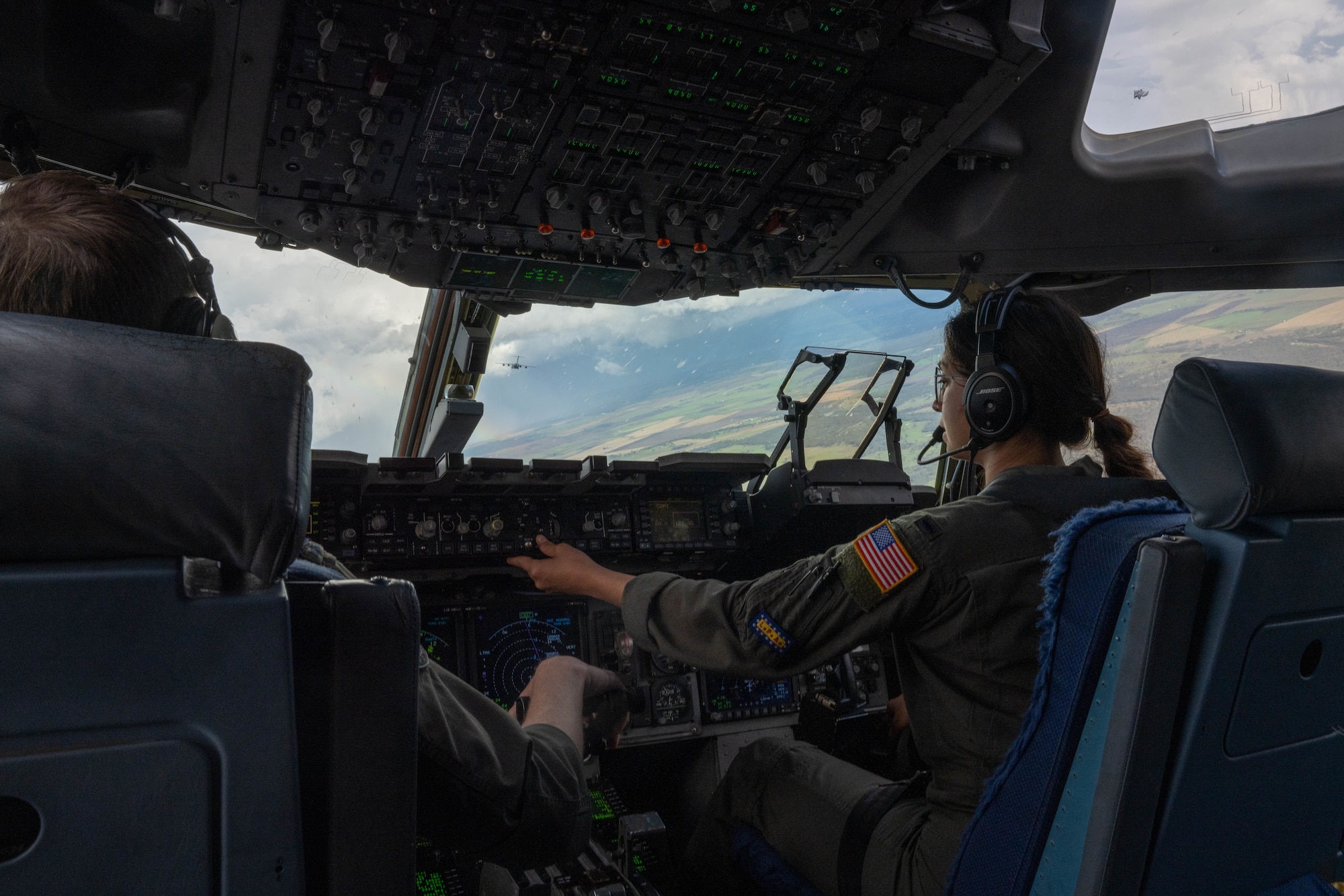 U.S Air Force 1st Lt. Cassidy Mullen, 535th Airlift Squadron pilot, flies a C-17 Globemaster III during a training flight during Exercise Global Dexterity 23-2 around Queensland, Australia, Nov. 28, 2023. This exercise is designed so that the U.S. Air Force and the Royal Australian Air Force can develop bilateral tactical airlift capabilities and learn from each other to strengthen partnerships in the Indo-Pacific Region.(U.S. Air Force photo by Senior Airman Makensie Cooper)