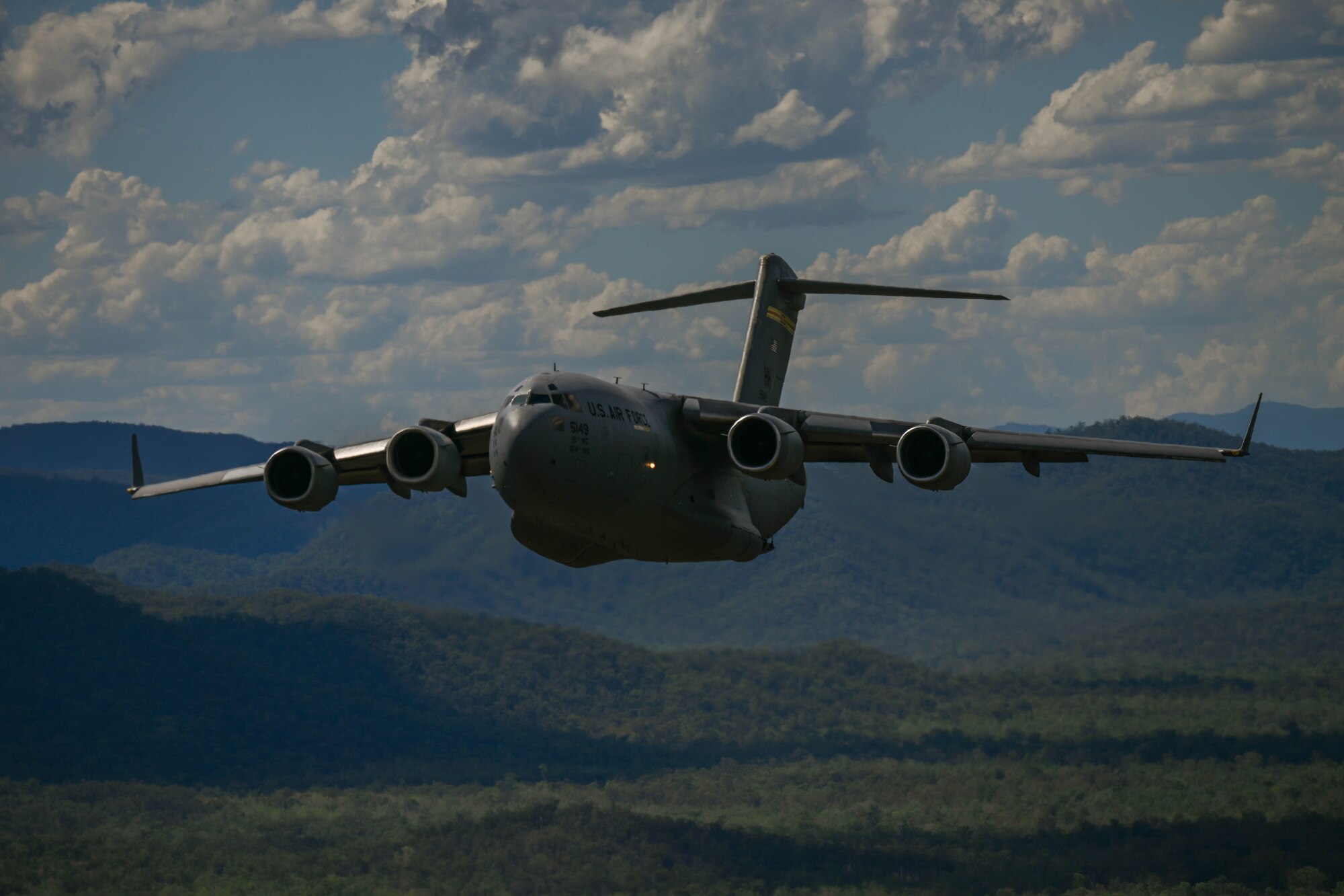 U.S. Air Force and Royal Australian Air Force C-17 Globemaster IIIs fly in a three-ship formation during Exercise Global Dexterity 23-2 while performing a training flight around the skies of Australia, Nov. 28, 2023. The exercise represents the key partnership between the U.S. and Australia that allows continued security and stability in the Indo-Pacific region.(U.S. Air Force photo by Senior Airman Makensie Cooper)