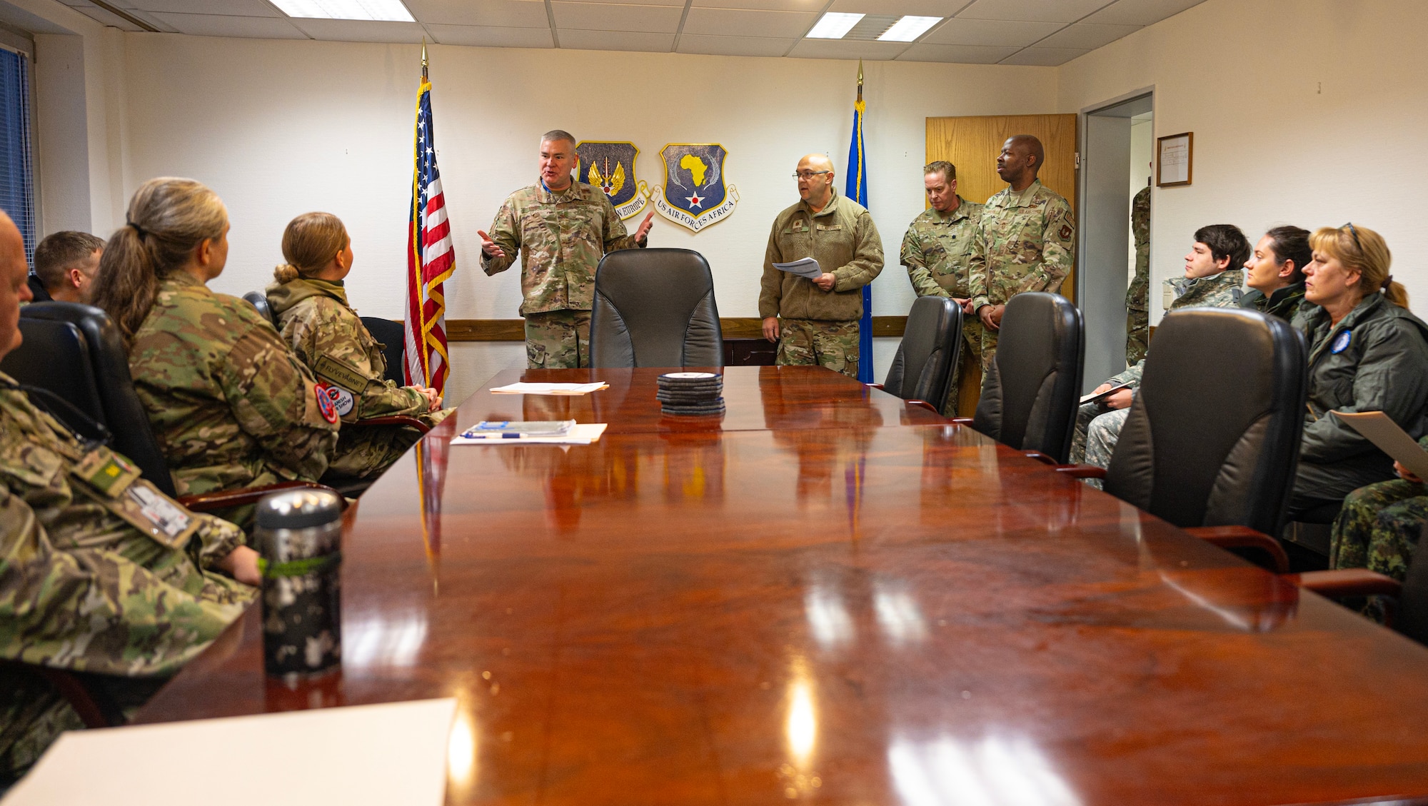 U.S. Air Force Col. Steven Lehr, United States Air Forces in Europe- Air Forces Africa Command Surgeon, speaks to a group of medical personnel at Ramstein Air Base, Germany, Nov. 28, 2023. The USAFE-AFAFRICA Office of the Command Surgeon hosted a knowledge exchange between the NATO allies Bulgaria and Denmark as well as partner Serbia where the had discussions and demonstrations about different topics in the medical field. (U.S. Air Force photo by Senior Airman Thomas Karol)