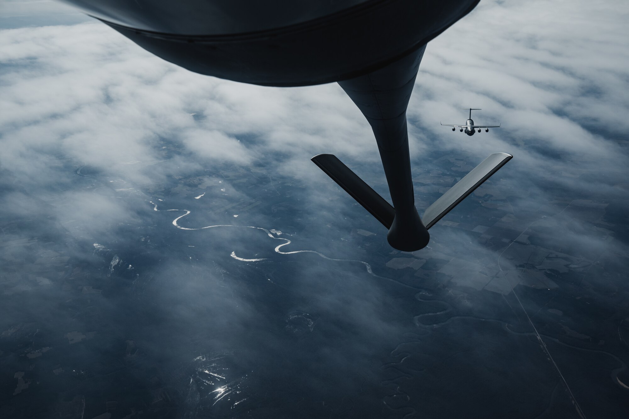 A C-17 Globemaster III assigned to the 15th Airlift Squadron, Joint Base Charleston, South Carolina, approaches a KC-135 Stratotanker assigned to the 63rd Air Refueling Squadron, MacDill Air Force Base, Florida, over the Southeastern United States, Nov. 28, 2023.