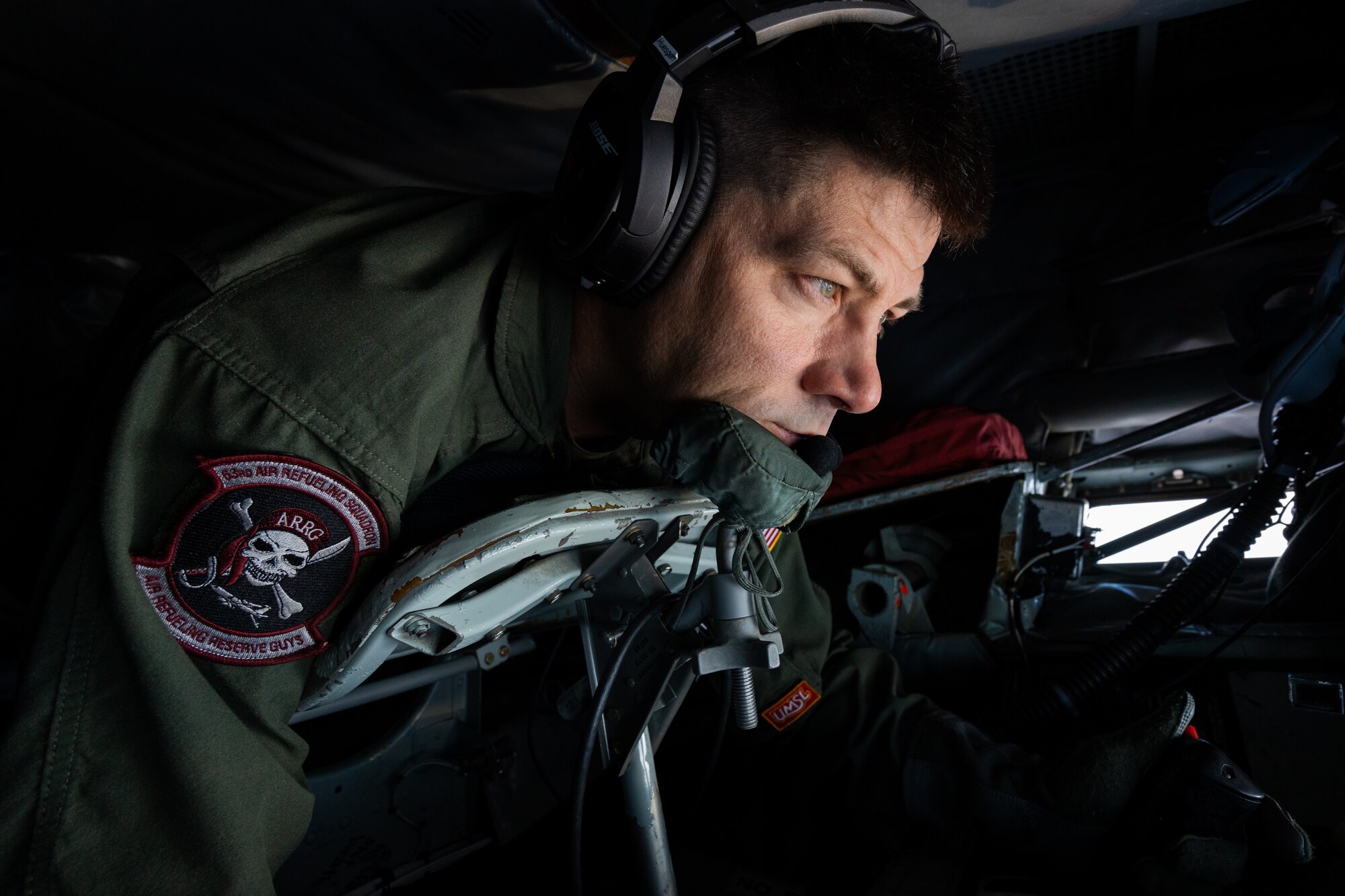 U.S. Air Force Staff Sgt. Robert Huesgen, 63rd Air Refueling Squadron boom operator, performs aerial refueling duties over the Southeastern United States, Nov. 28, 2023.